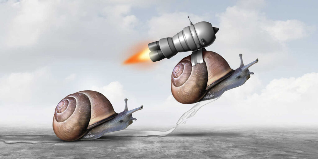Two snails, one with a rocket pack on his back shooting upwards and forwards representing the advantages of SEO Hosting
